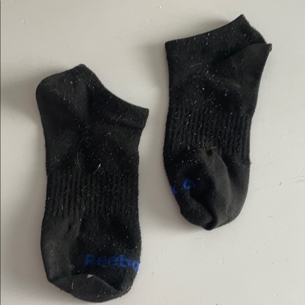 Ripped worn black socks